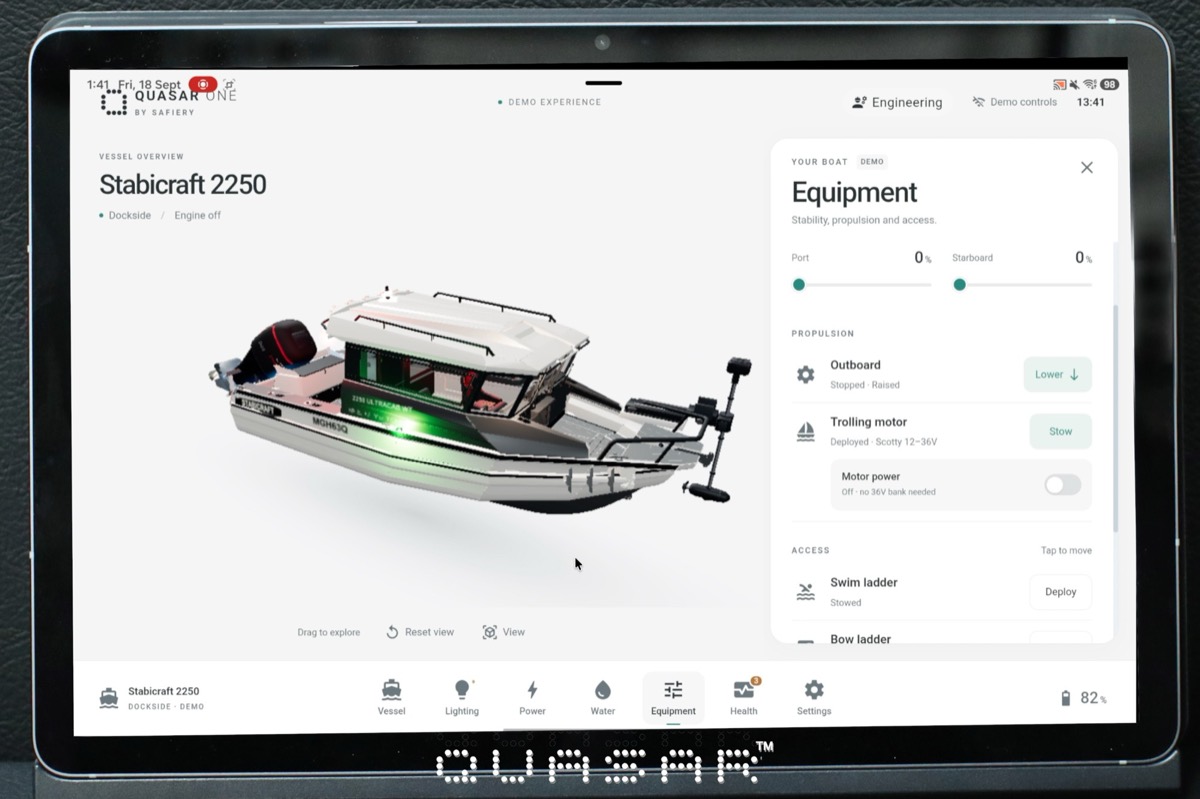 Quasar ONE touch display showing an animated 3D model of a Stabicraft 2250 with its Equipment panel: trim tabs, outboard, trolling motor and swim ladder controls
